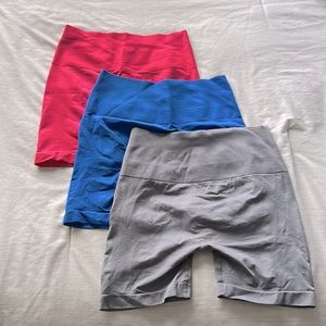 High-waisted bike shorts size S. Colors gray, blue, and pink. New condition.
